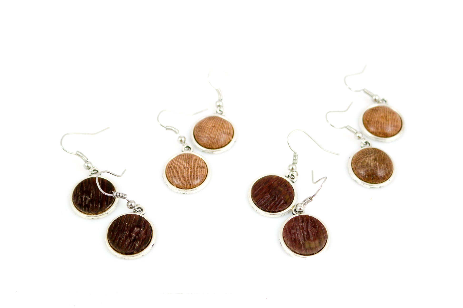 These beautiful silver plated earrings are crafted from retired grapevines. Years of producing wine and now reclaimed into these amazing pieces of jewelry. Each piece is hand cut and assembled into fabulous art. Modern and chic yet wonderfully rustic. Stylishly sexy, and completely made from recycled barrels. This is functional art at its best and a delight to have.