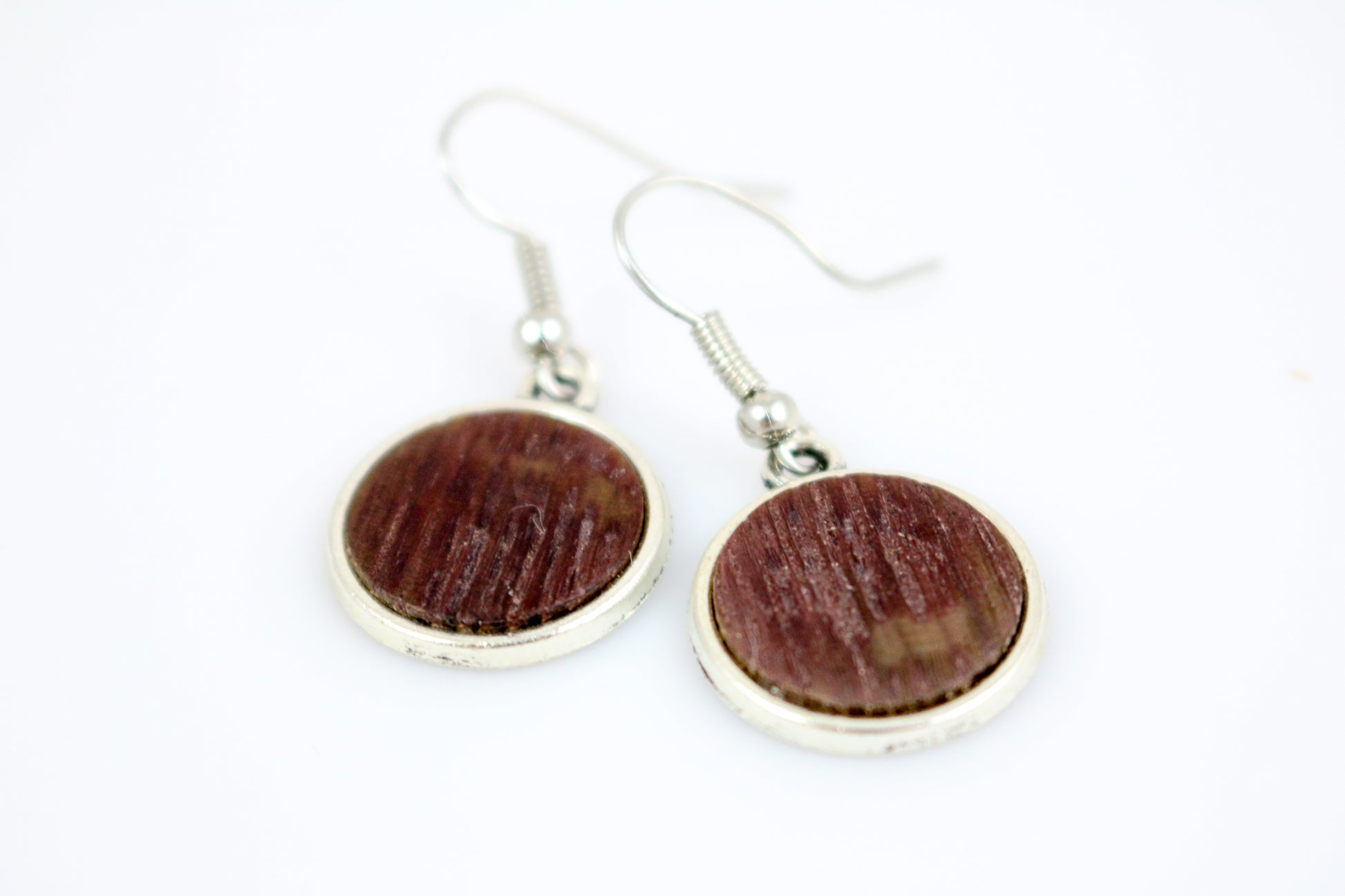 These beautiful silver plated earrings are crafted from reclaimed barrels that were making wine for years in the heart of wine country. Years of producing wine and now reclaimed into these amazing pieces of jewelry. Each piece is hand cut and assembled into fabulous art. Modern and chic yet wonderfully rustic. Stylishly sexy, and completely made from recycled barrels. This is functional art at its best and a delight to have.